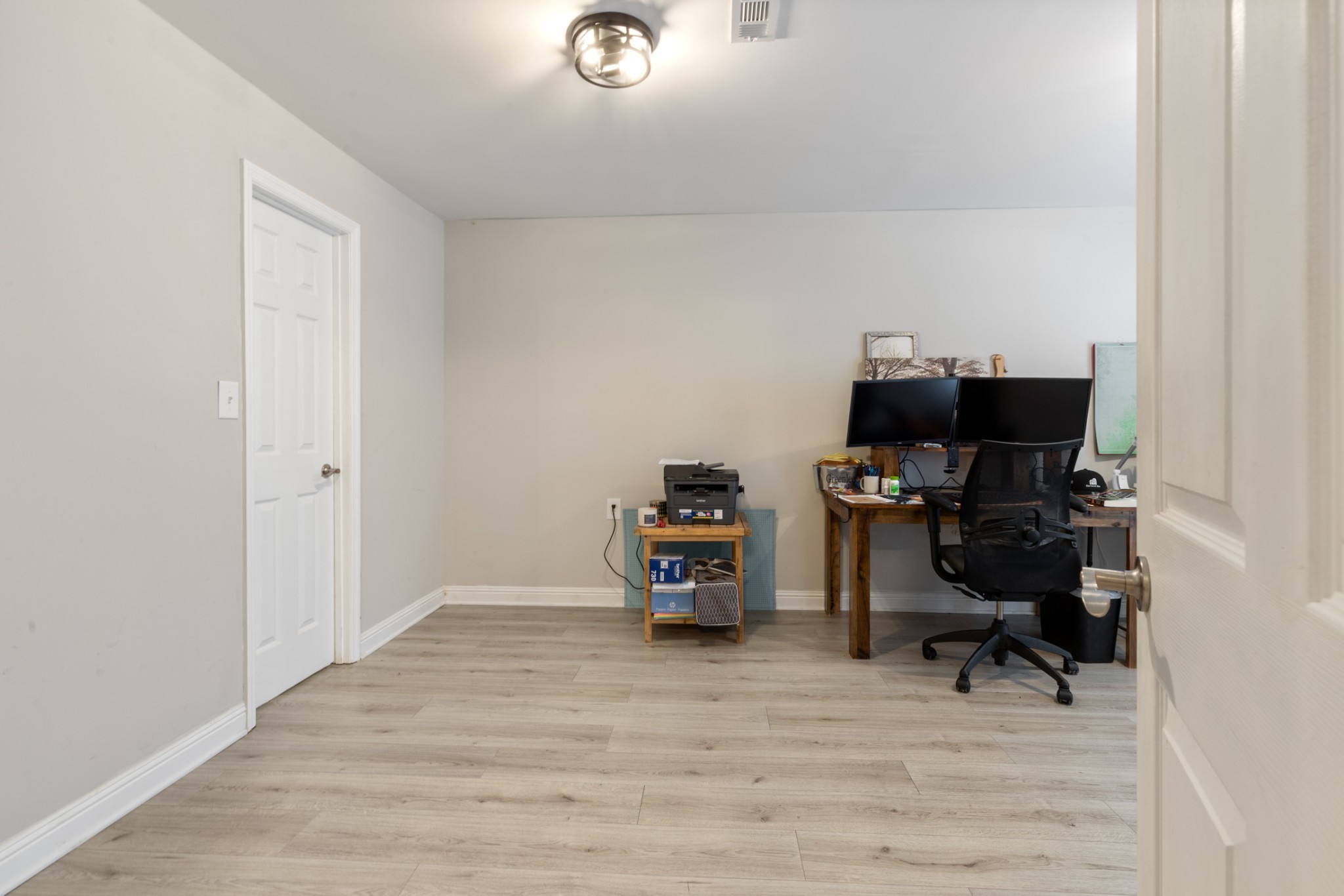 2323 Nubbin Ridge Road Dickson, TN 37055 - Photo 39 of 51 a view of a workspace with furniture and wooden floor