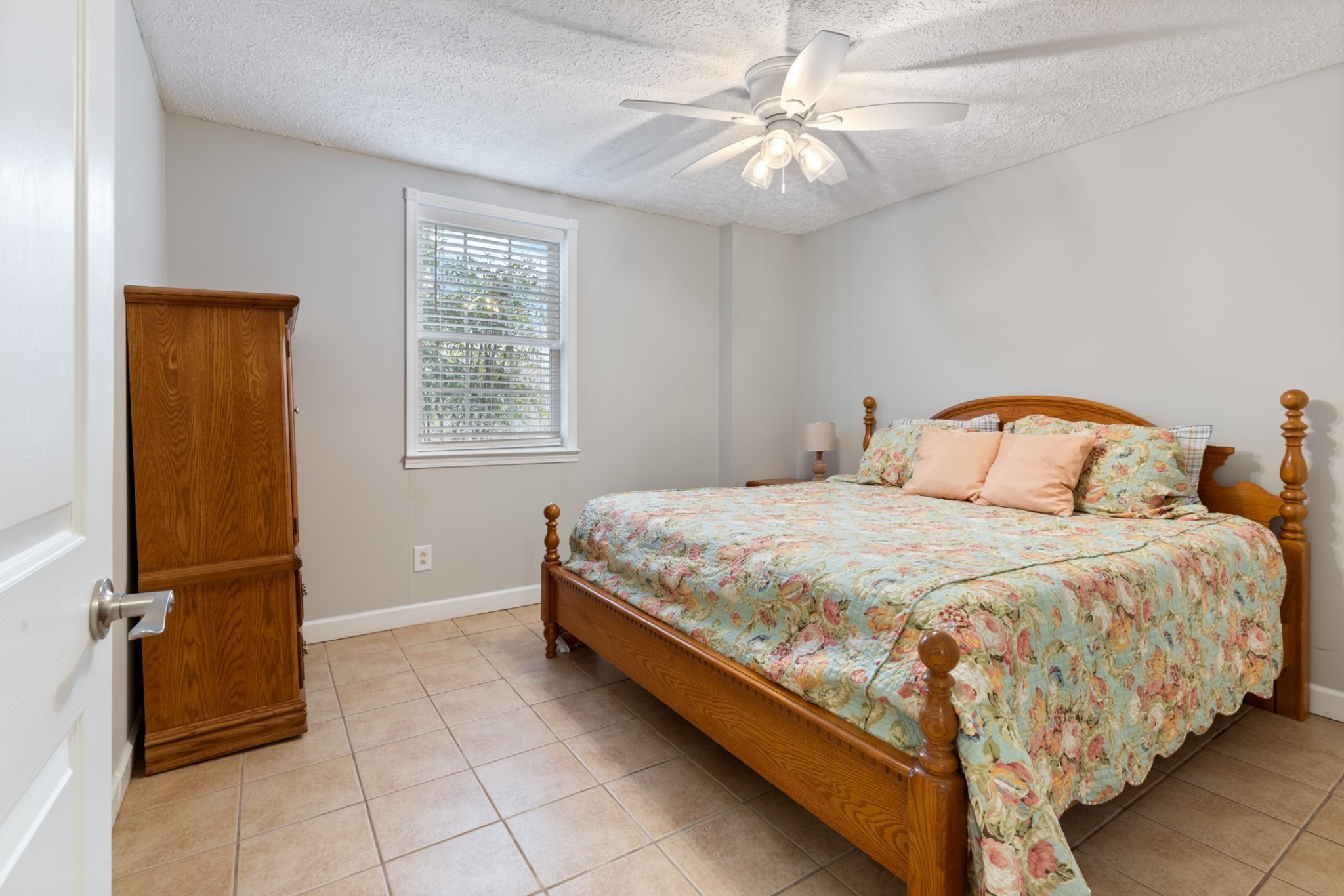 2323 Nubbin Ridge Road Dickson, TN 37055 - Photo 46 of 51 a bedroom with a bed and a chandelier