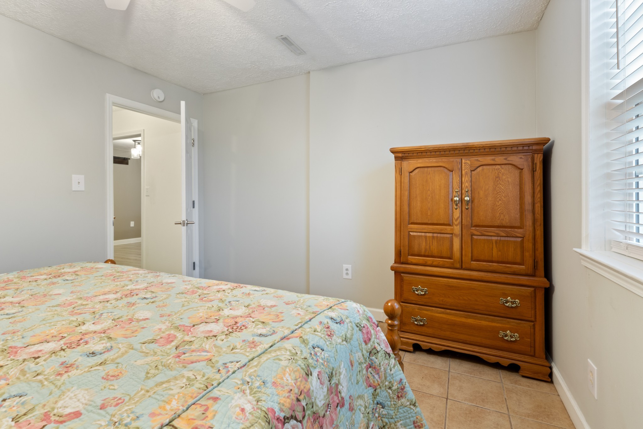 2323 Nubbin Ridge Road Dickson, TN 37055 - Photo 47 of 51 a bedroom with a bed and a dresser
