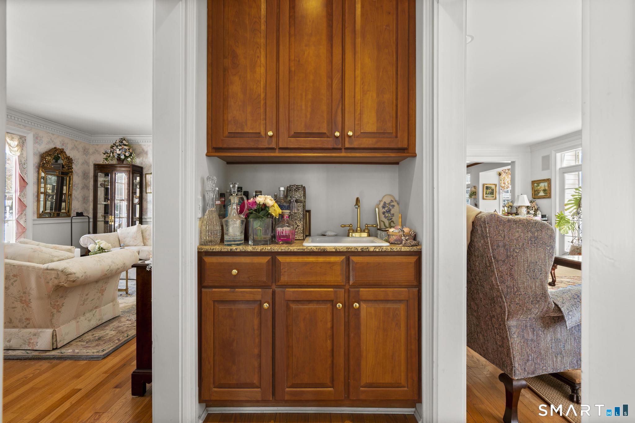 9 Perkins Road Woodbridge, CT 06525 - Photo 17 of 38 Wet bar off of office separating formal living room and family room