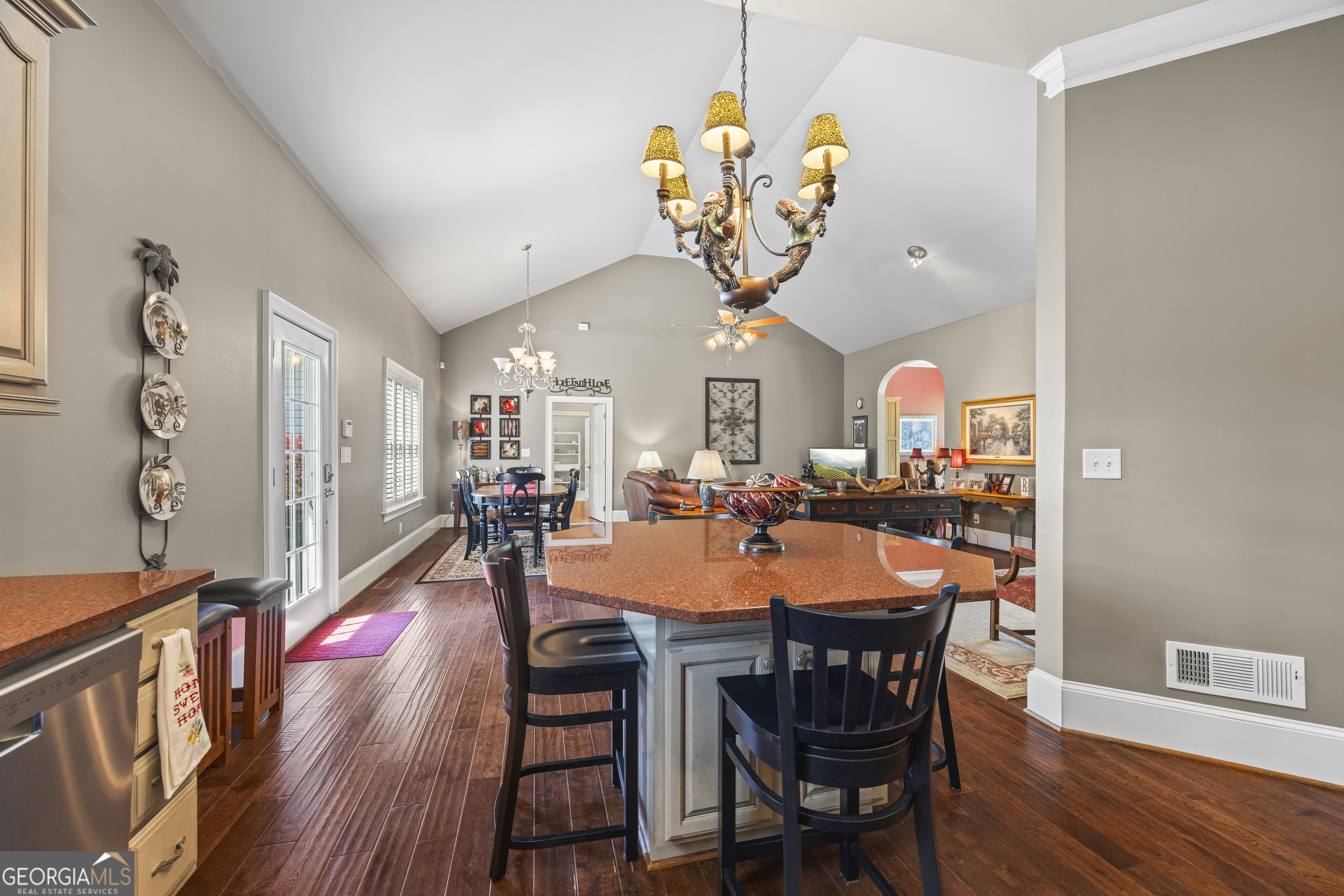 160 Evans Road Bogart, GA 30622 - Photo 105 of 157 a view of a dining room and livingroom with furniture wooden floor a chandelier