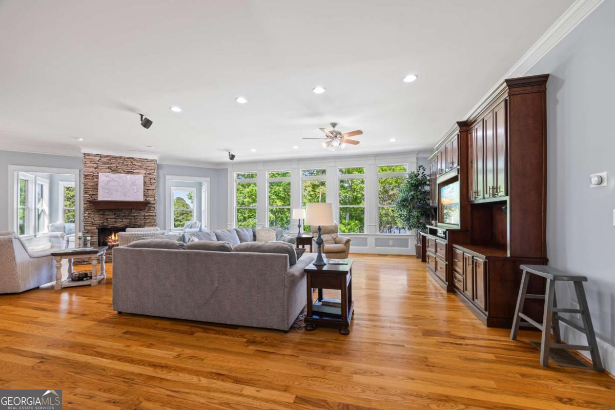 160 Evans Road Bogart, GA 30622 - Photo 22 of 157 a living room with furniture a flat screen tv and a large window