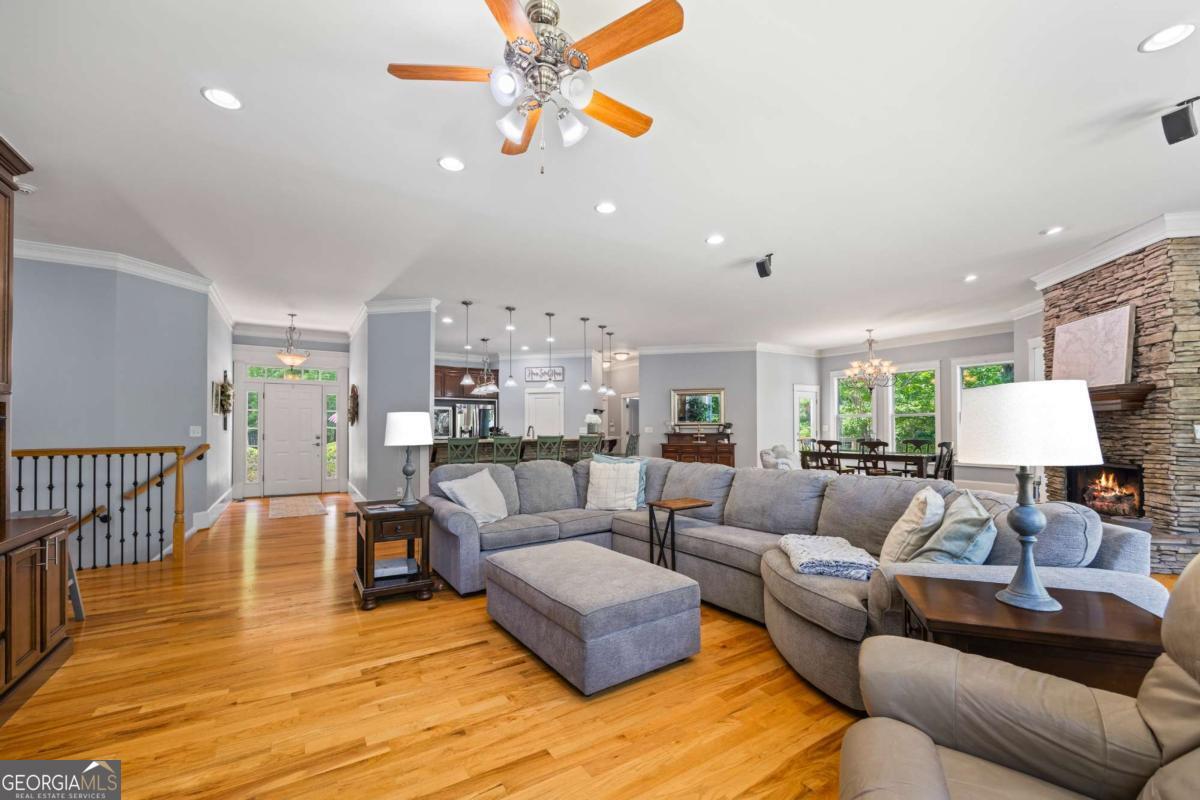 160 Evans Road Bogart, GA 30622 - Photo 27 of 157 a living room with furniture and a wooden floor