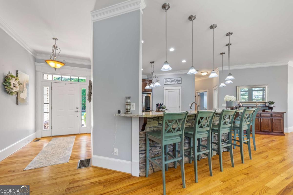 160 Evans Road Bogart, GA 30622 - Photo 55 of 157 a view of a dining room with furniture and wooden floor