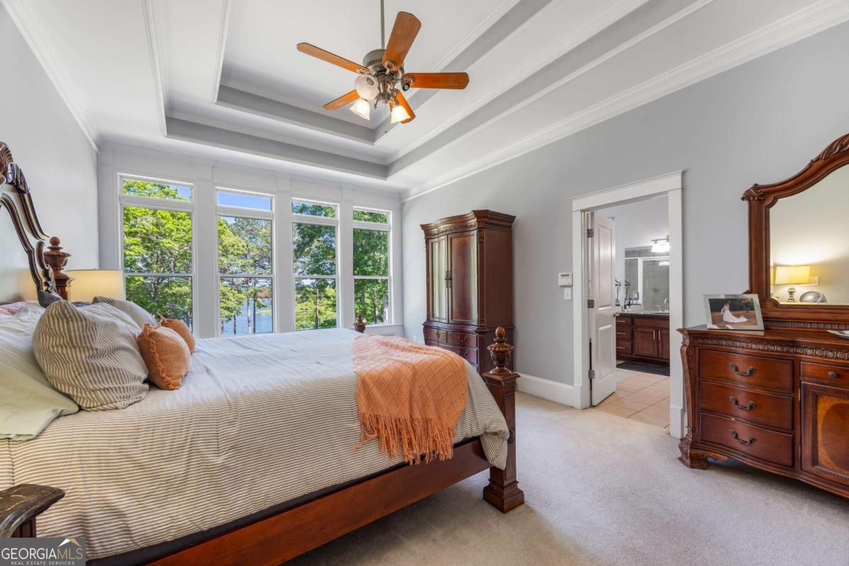 160 Evans Road Bogart, GA 30622 - Photo 60 of 157 a bedroom with a bed and a large mirror on the dresser