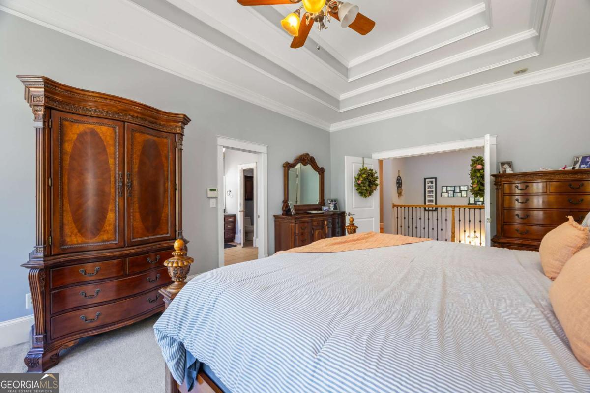 160 Evans Road Bogart, GA 30622 - Photo 61 of 157 a bed room with a bed mirror and a dresser