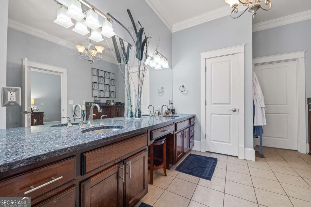160 Evans Road Bogart, GA 30622 - Photo 66 of 157 a spacious bathroom with a granite countertop sink a mirror and a shower