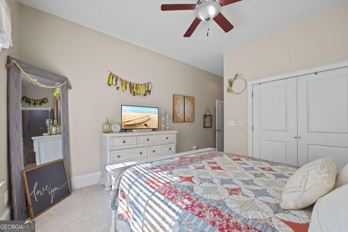 160 Evans Road Bogart, GA 30622 - Photo 70 of 157 a bedroom with a bed and a dresser in it