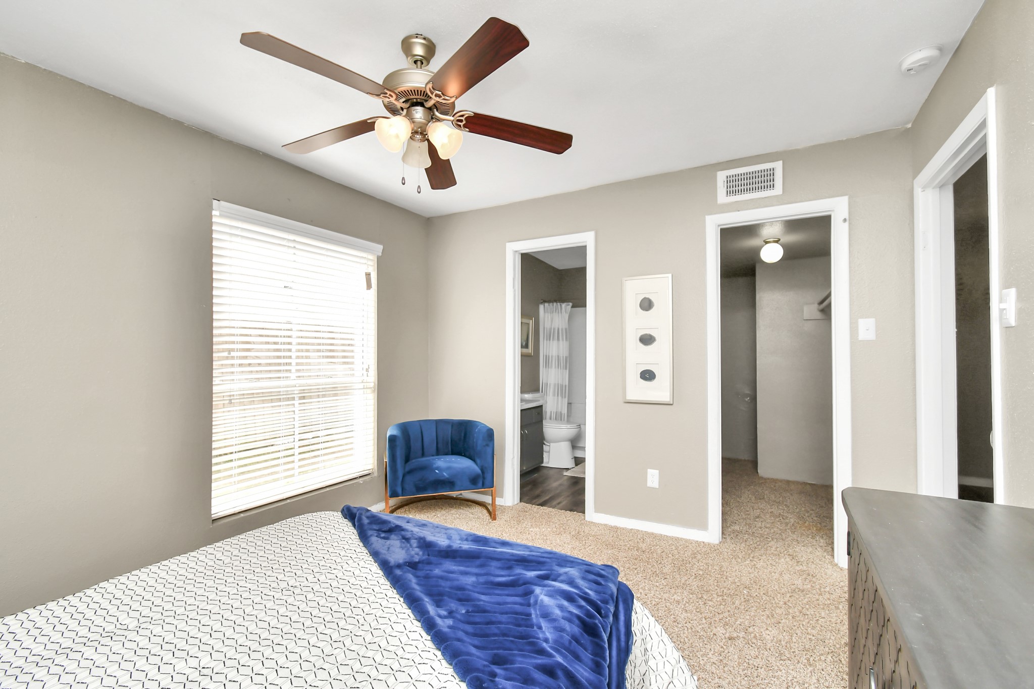 12211 Fondren Road, Unit 1112 Houston, TX 77035 - Photo 17 of 30 a bedroom with a bed and a large window