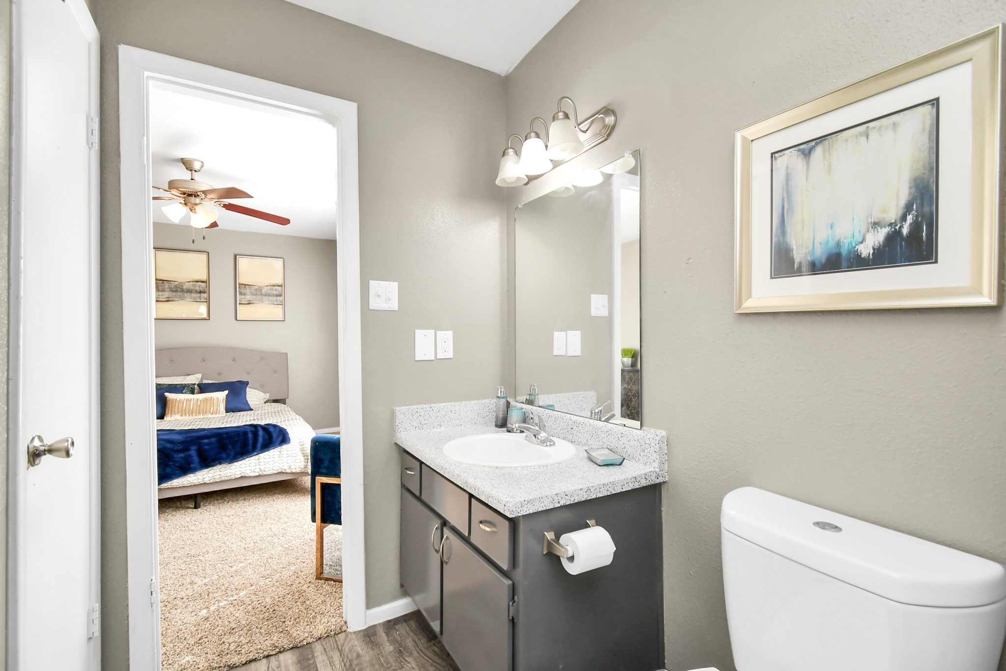 12211 Fondren Road, Unit 1112 Houston, TX 77035 - Photo 19 of 30 a en suite bathroom with a toilet sink and mirror