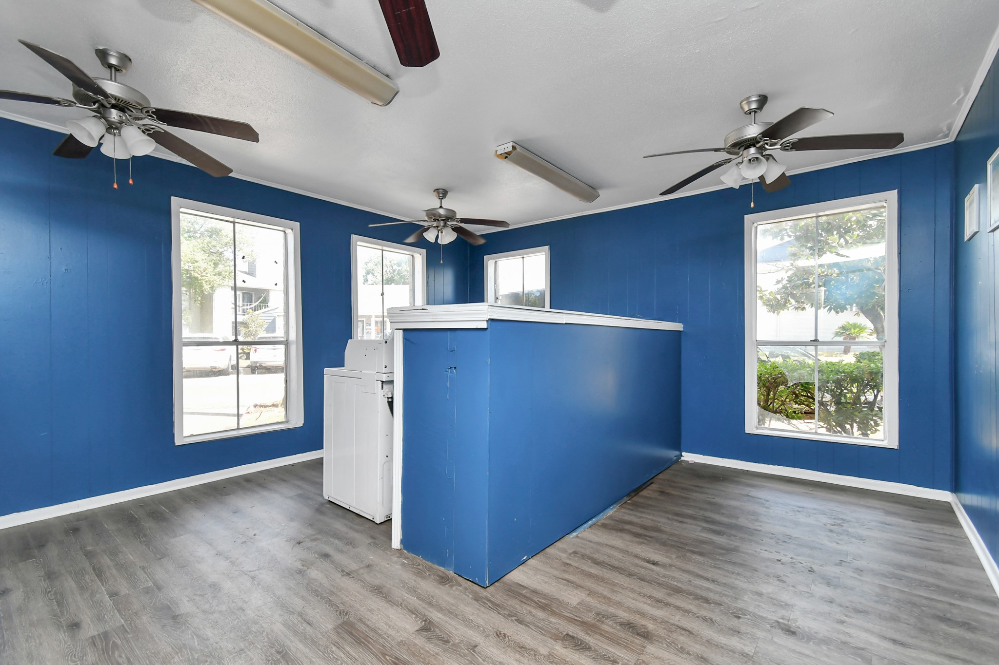 12211 Fondren Road, Unit 1112 Houston, TX 77035 - Photo 23 of 30 a view of an empty room with a window and wooden floor