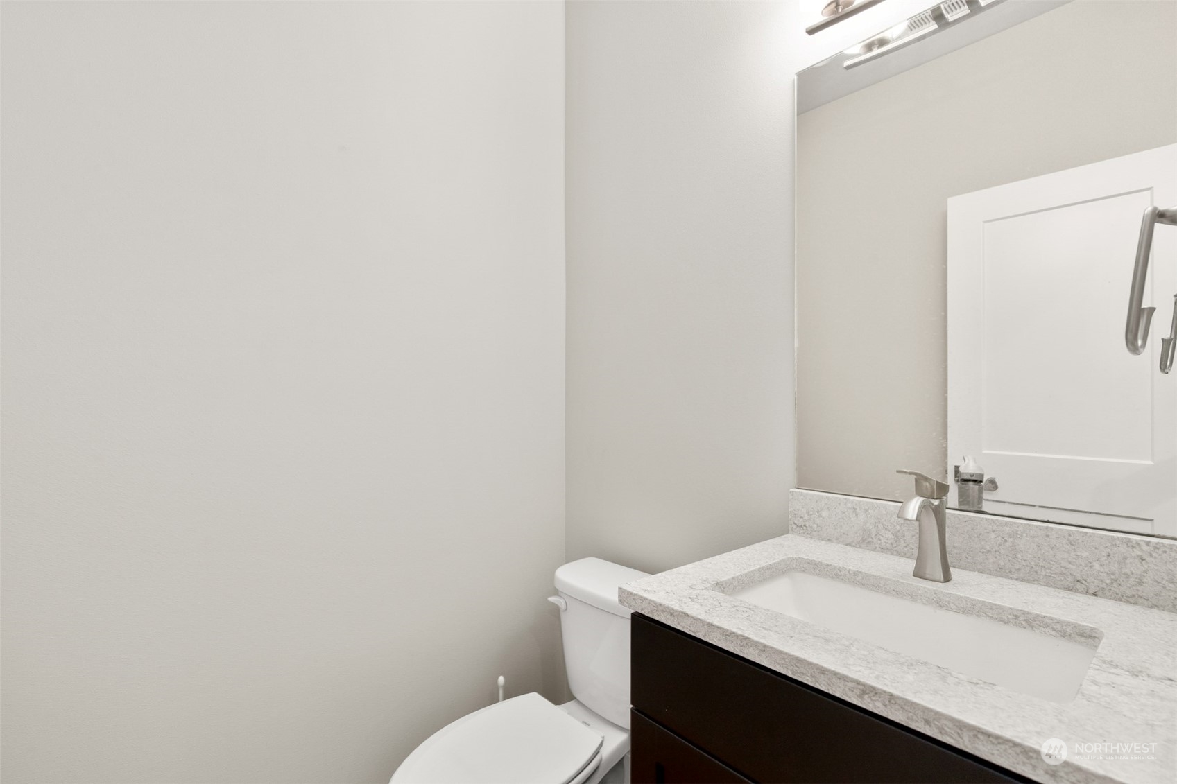 23319 15th Avenue Southeast Bothell, WA 98021 - Photo 18 of 40 a bathroom with a granite countertop sink toilet and mirror