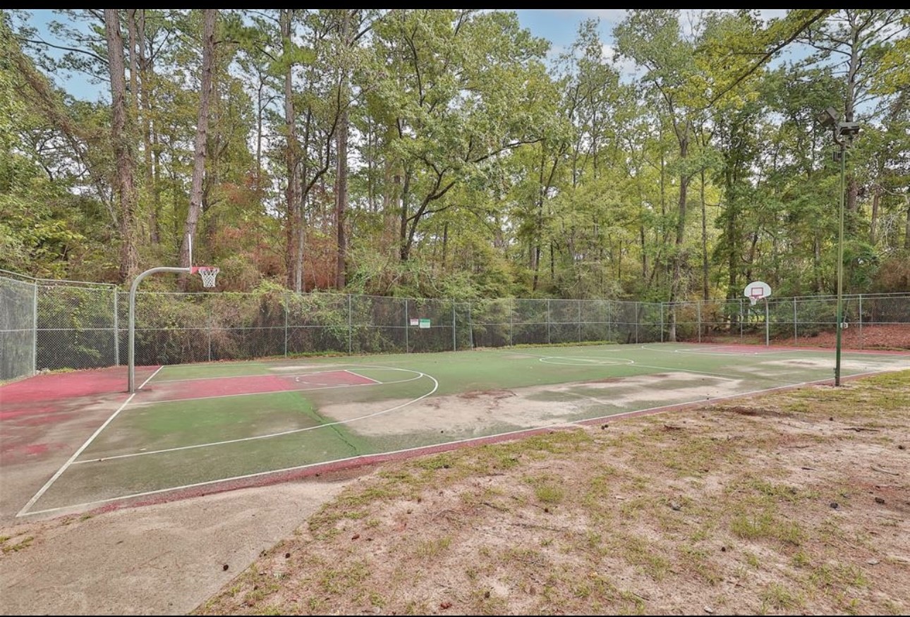 31 Green Tree Drive Coldspring, TX 77331 - Photo 3 of 7 a view of a tennis ground with large trees