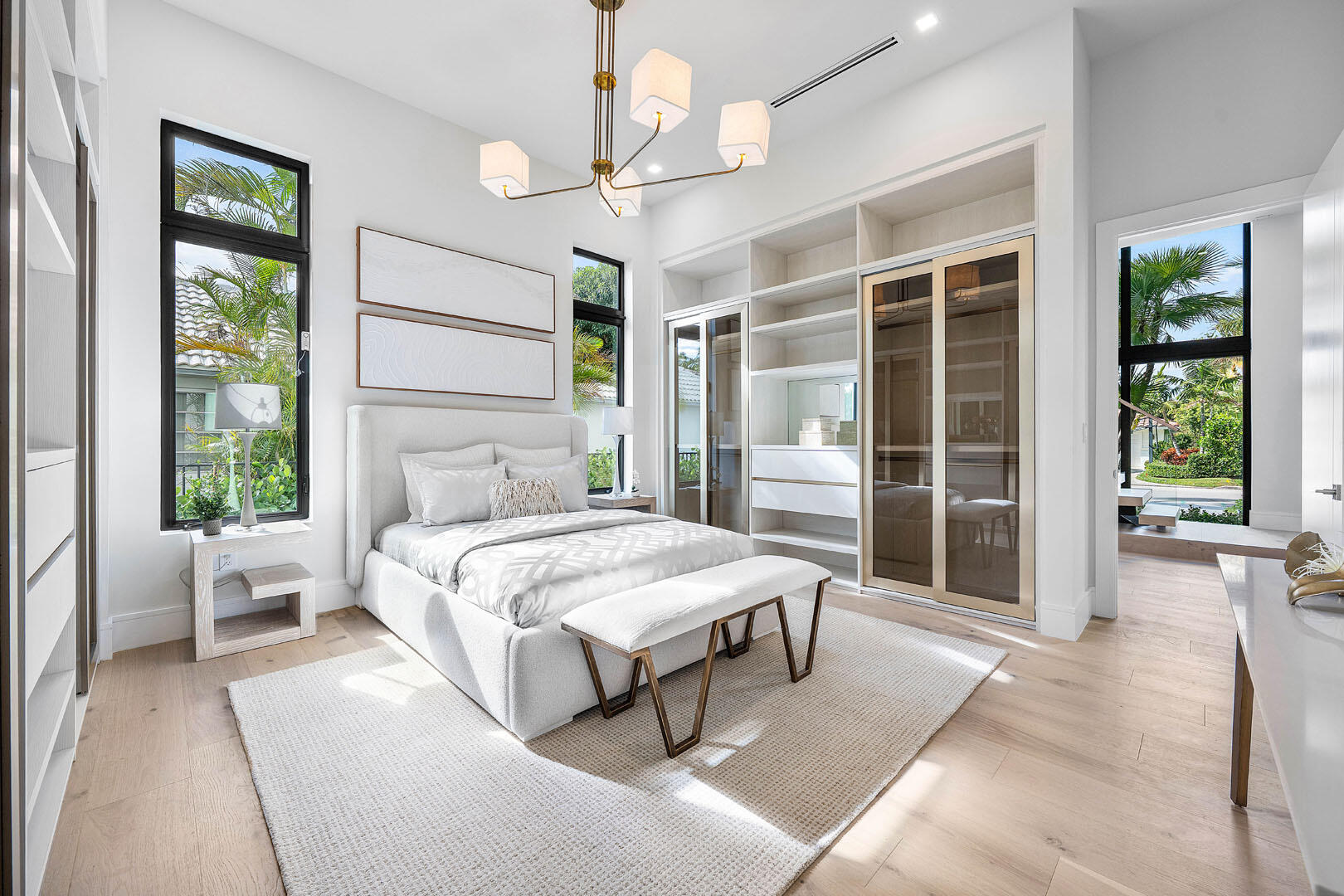 2240 Date Palm Road Boca Raton, FL 33432 - Photo 36 of 89 a bedroom with a large bed and a chandelier fan