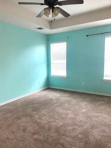 a view of a room that has a window in it