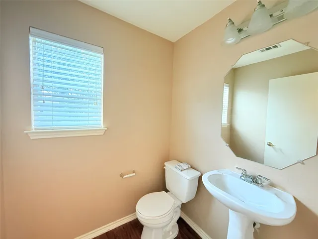 a bedroom with a bed and a mirror