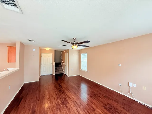 a kitchen with wooden floor and a stove