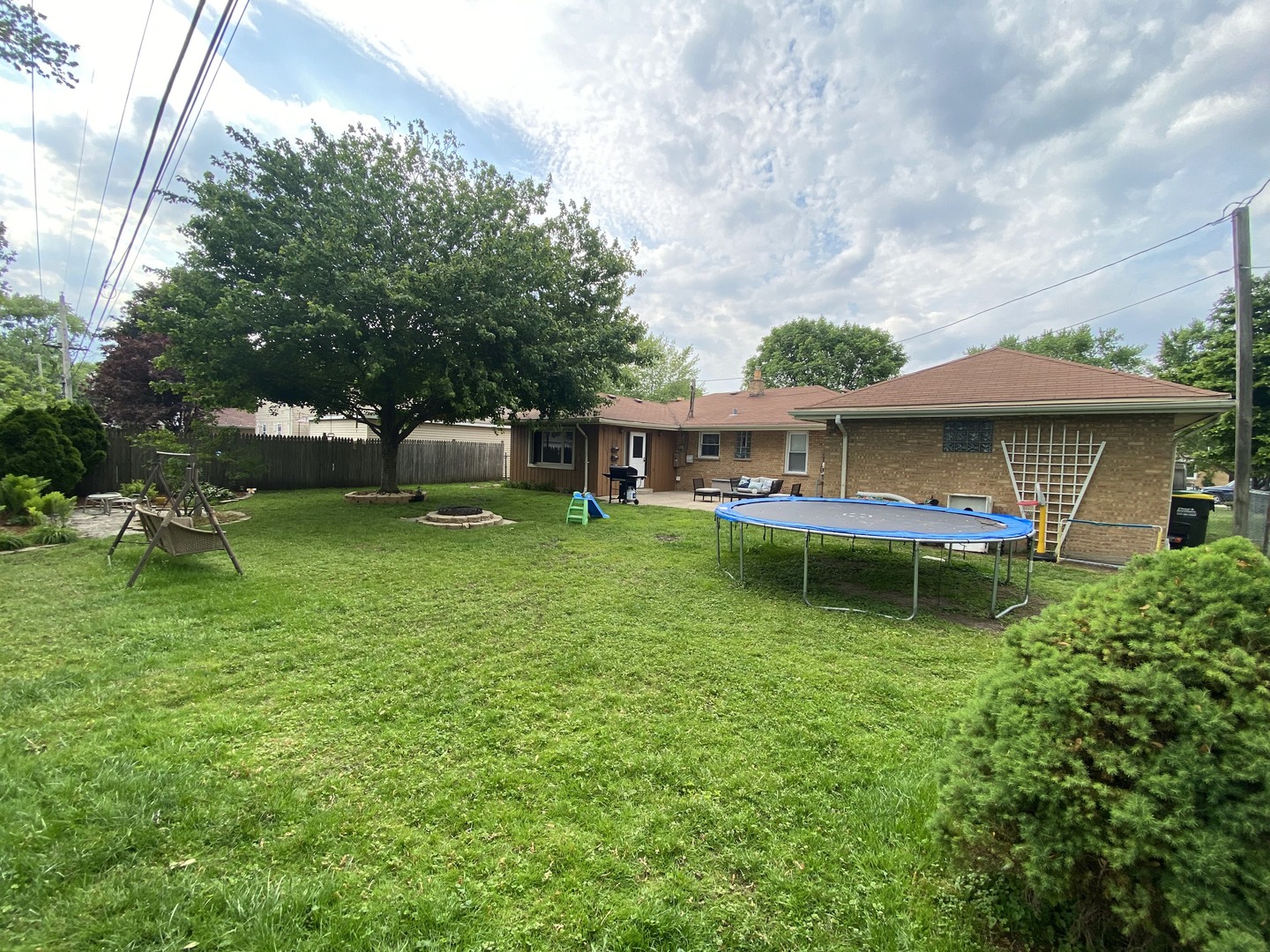 5831 109th Place Chicago Ridge, IL 60415 - Photo 19 of 19 a view of a house with a yard table and chairs