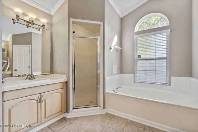 a bathroom with a sink a toilet and shower curtain