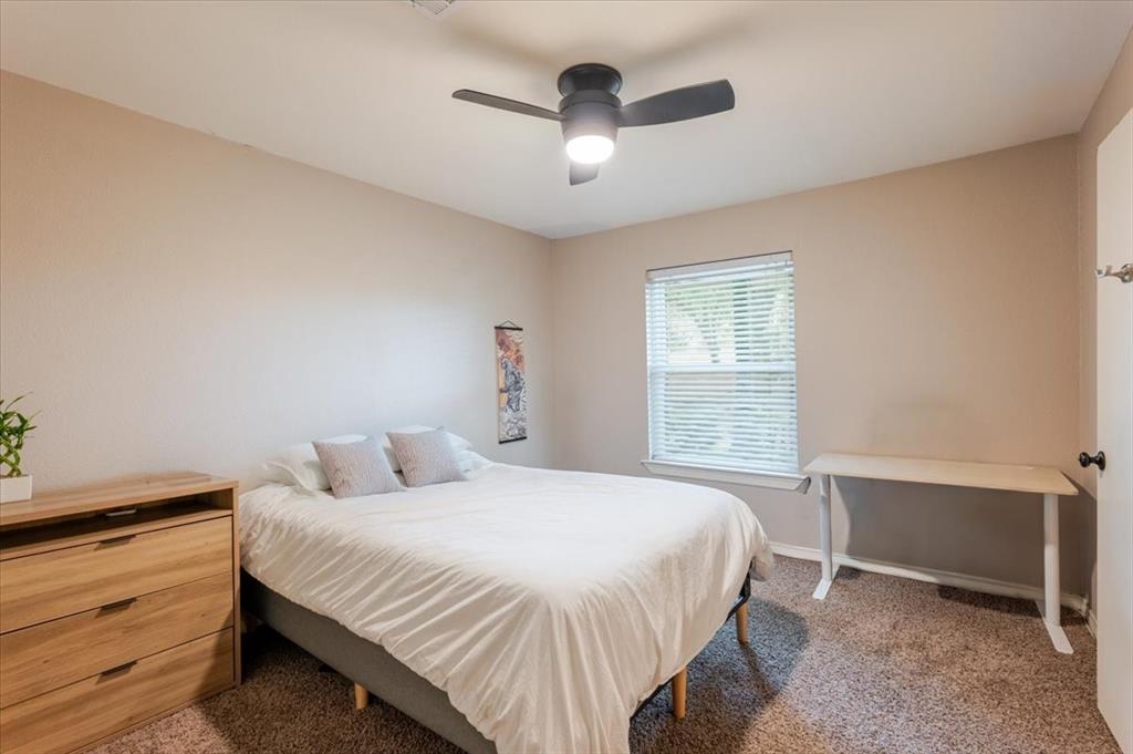 1507 Greenbrier Drive Sherman, TX 75092 - Photo 11 of 27 a bedroom with a bed and a window