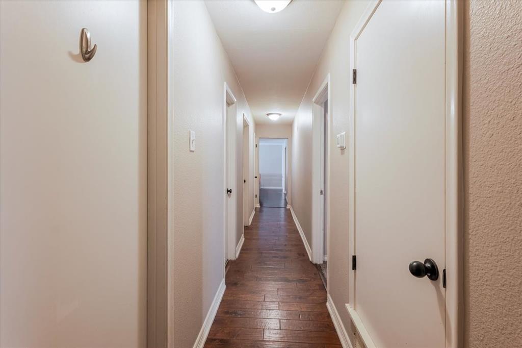 1507 Greenbrier Drive Sherman, TX 75092 - Photo 16 of 27 a view of a hallway with wooden floor