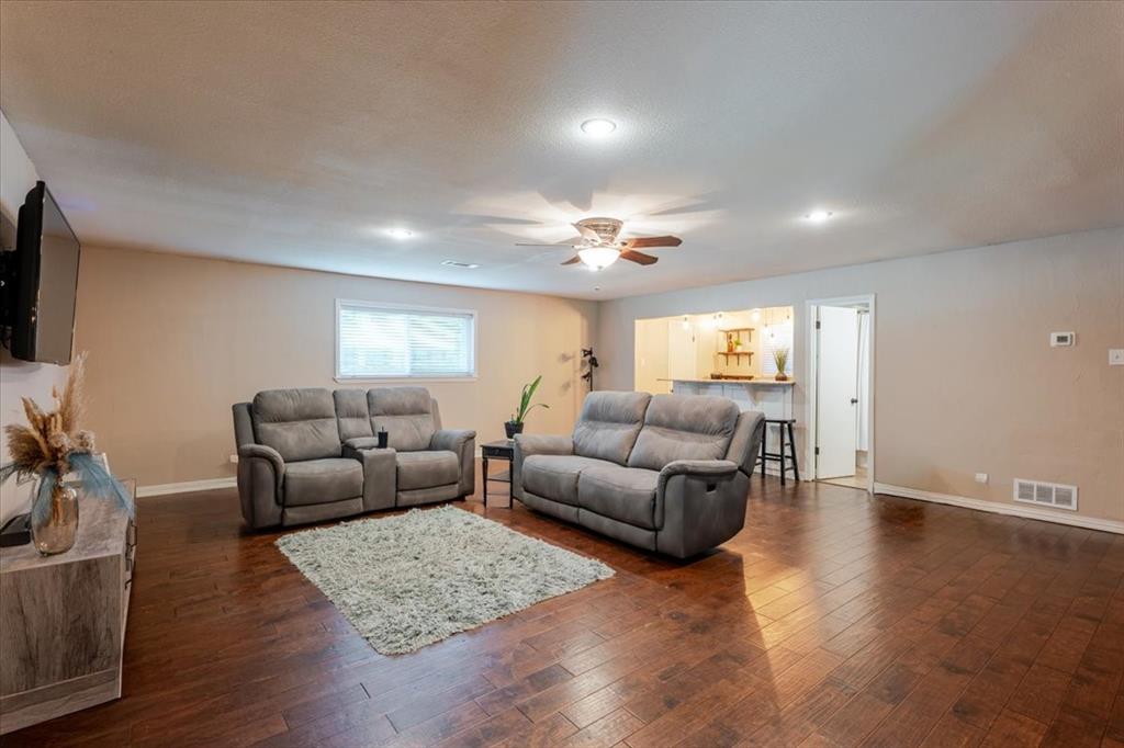 1507 Greenbrier Drive Sherman, TX 75092 - Photo 18 of 27 a living room with furniture and a flat screen tv