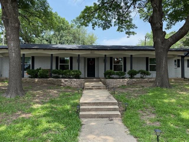 1507 Greenbrier Drive Sherman, TX 75092 - Photo 2 of 27 a front view of a house with yard and green space