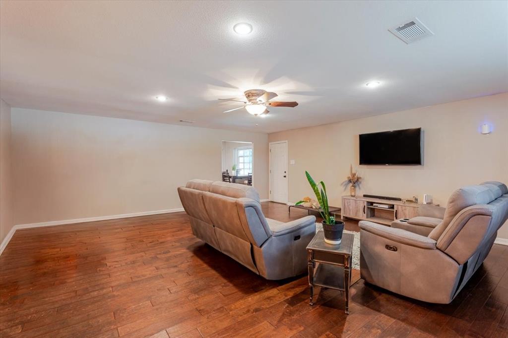 1507 Greenbrier Drive Sherman, TX 75092 - Photo 22 of 27 a living room with furniture and a flat screen tv