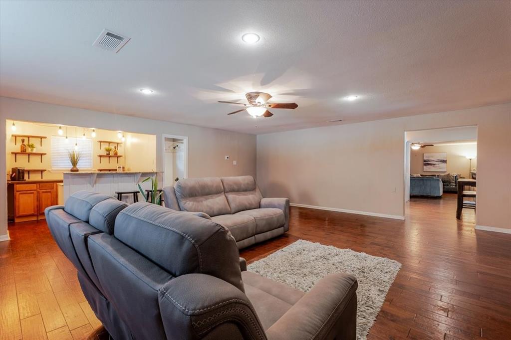 1507 Greenbrier Drive Sherman, TX 75092 - Photo 23 of 27 a living room with furniture and wooden floor