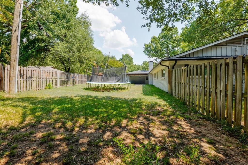 1507 Greenbrier Drive Sherman, TX 75092 - Photo 27 of 27 a view of a backyard with a small cabin