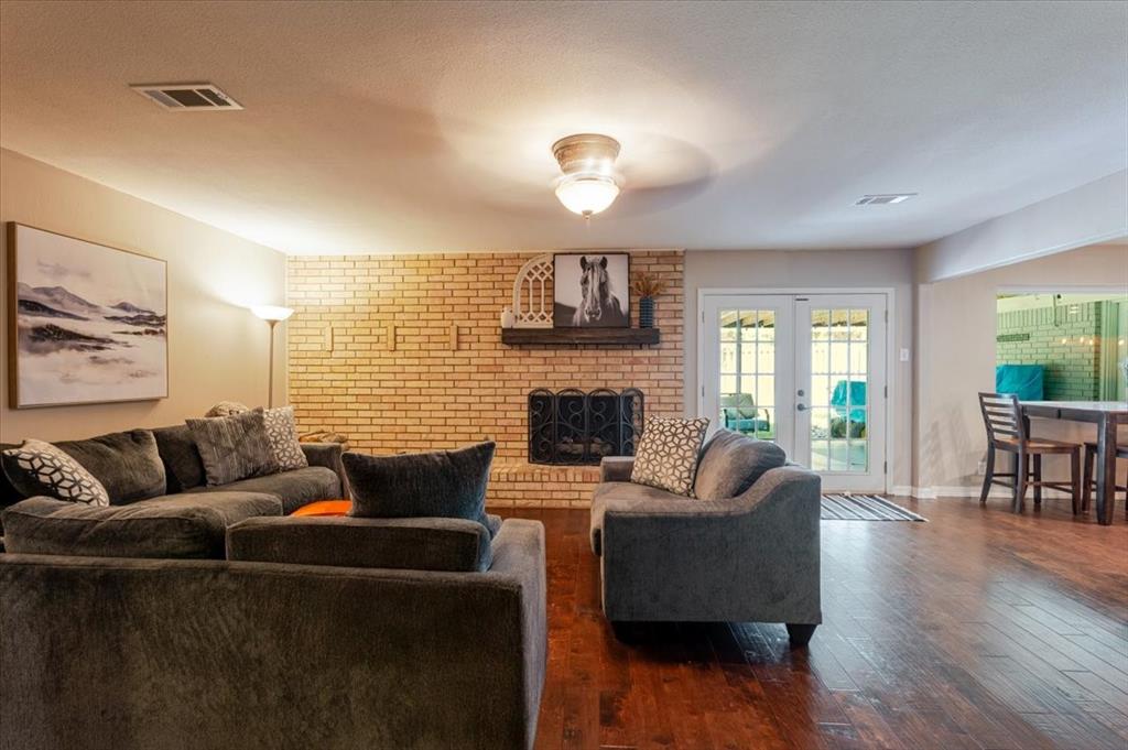 1507 Greenbrier Drive Sherman, TX 75092 - Photo 9 of 27 a living room with furniture and a fireplace