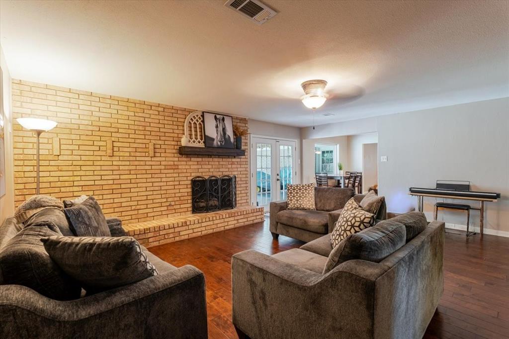 1507 Greenbrier Drive Sherman, TX 75092 - Photo 10 of 27 a living room with furniture and a fireplace