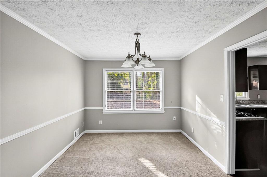 1075 Forest Heights Road Stone Mountain, GA 30083 - Photo 11 of 42 a view of an empty room with a window