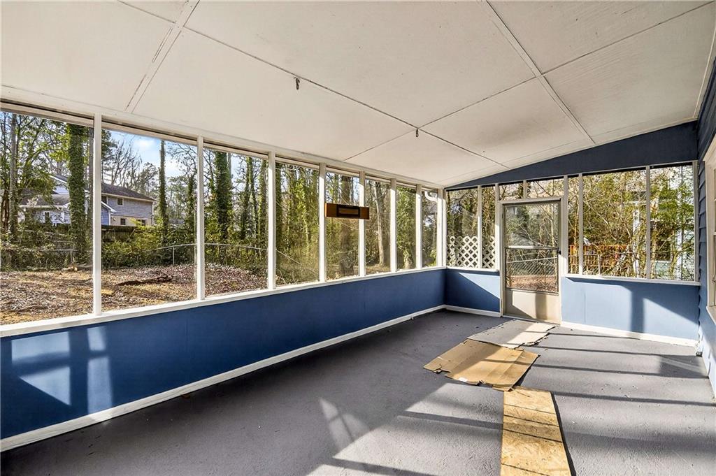 1075 Forest Heights Road Stone Mountain, GA 30083 - Photo 33 of 42 a living room with furniture and large windows