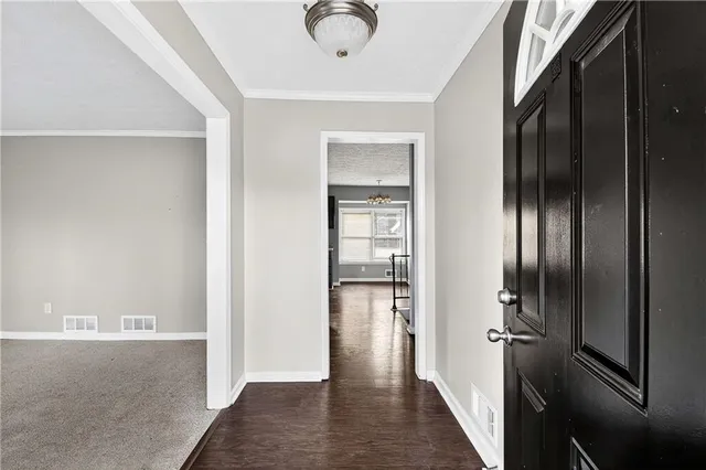 a view of hallway with wooden floor