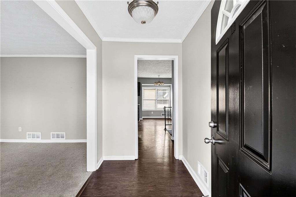 1075 Forest Heights Road Stone Mountain, GA 30083 - Photo 5 of 42 a view of hallway with wooden floor