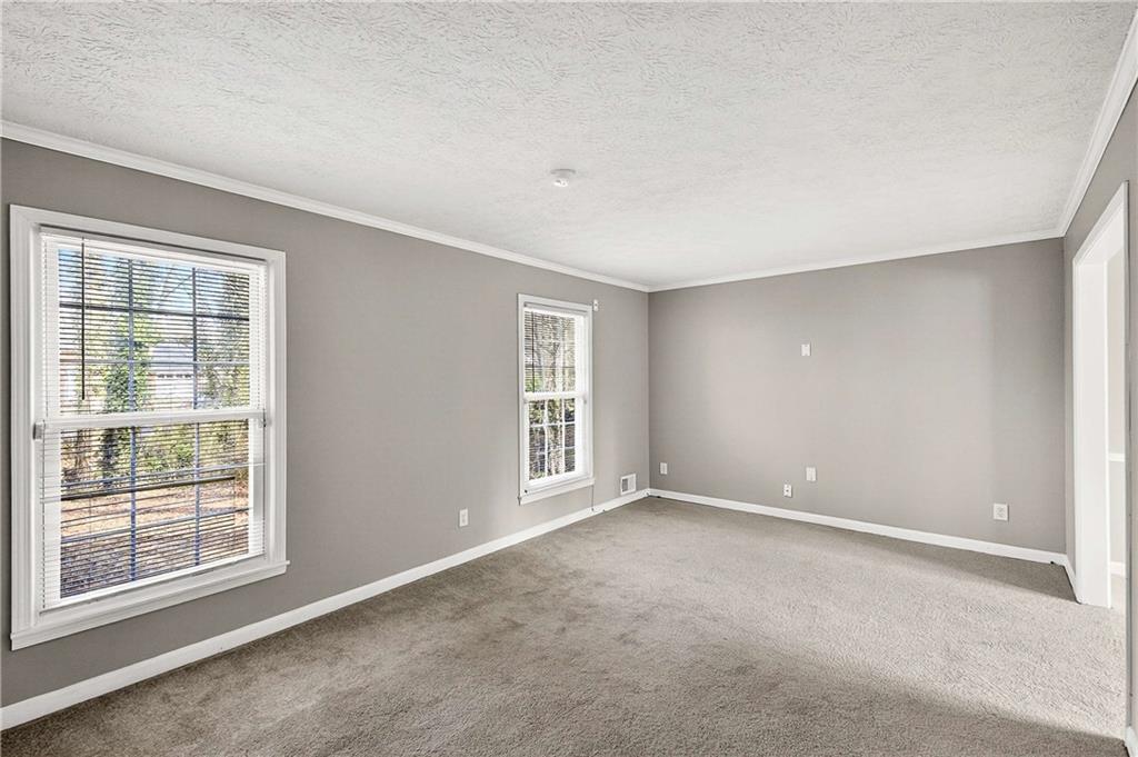 1075 Forest Heights Road Stone Mountain, GA 30083 - Photo 8 of 42 a view of an empty room with a window