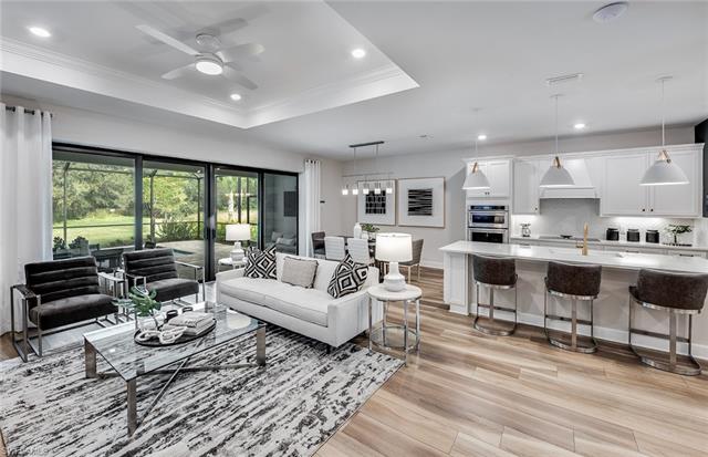 3974 East Hampton Circle Fort Myers, FL 33905 - Photo 18 of 36 a living room with furniture and a large window