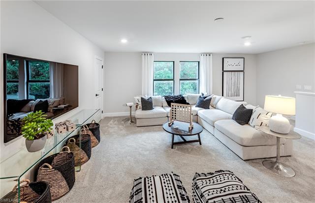 3974 East Hampton Circle Fort Myers, FL 33905 - Photo 23 of 36 a living room with furniture a window and a chandelier
