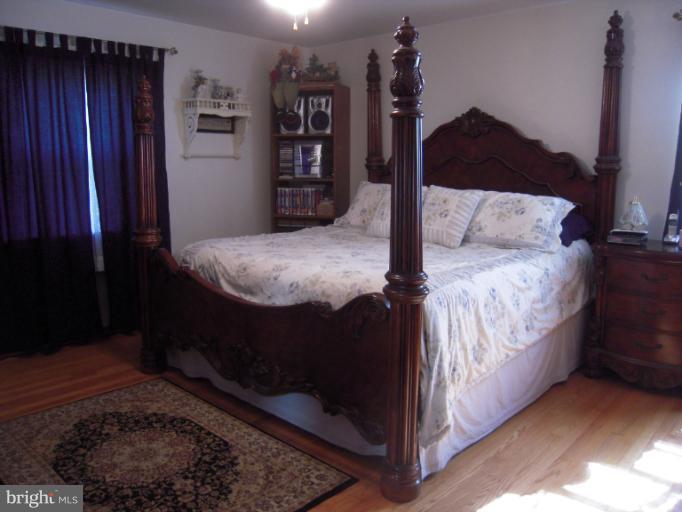 204 Dutrow Road Westminster, MD 21157 - Photo 14 of 16 a bedroom with a bed and a window