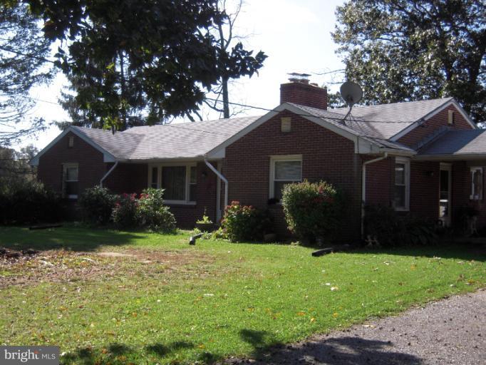 204 Dutrow Road Westminster, MD 21157 - Photo 4 of 16 a front view of a house with garden