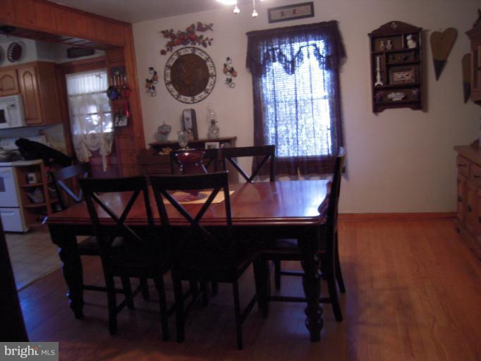 204 Dutrow Road Westminster, MD 21157 - Photo 8 of 16 a view of a dining room with furniture and chandelier