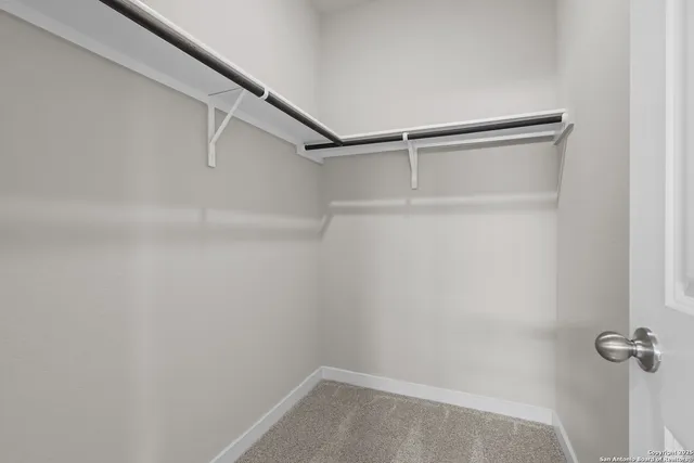 a view of an empty walk in closet