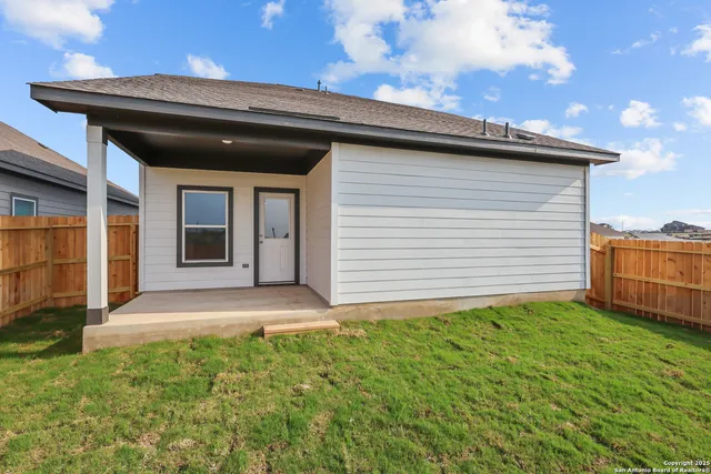 a view of a backyard of the house