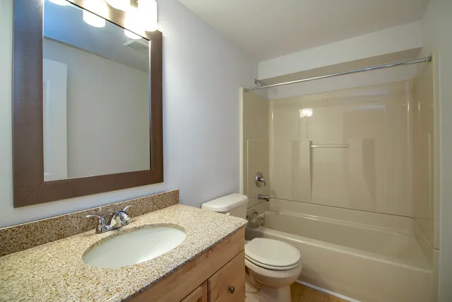 an empty room with a bench