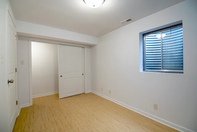 an aerial view of residential houses with outdoor space and lake view