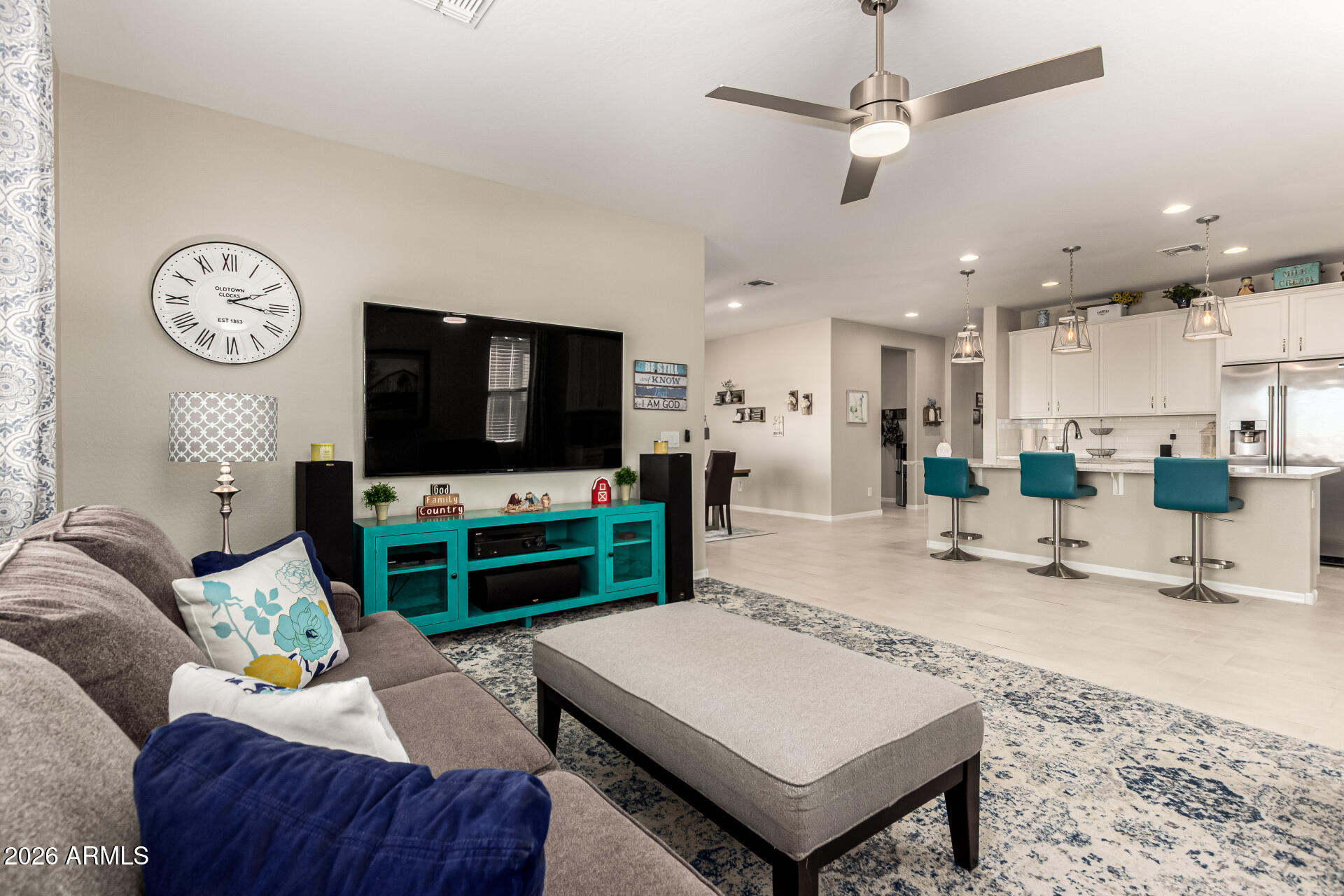 22494 East Russet Road Queen Creek, AZ 85142 - Photo 11 of 43 a living room with furniture and a flat screen tv