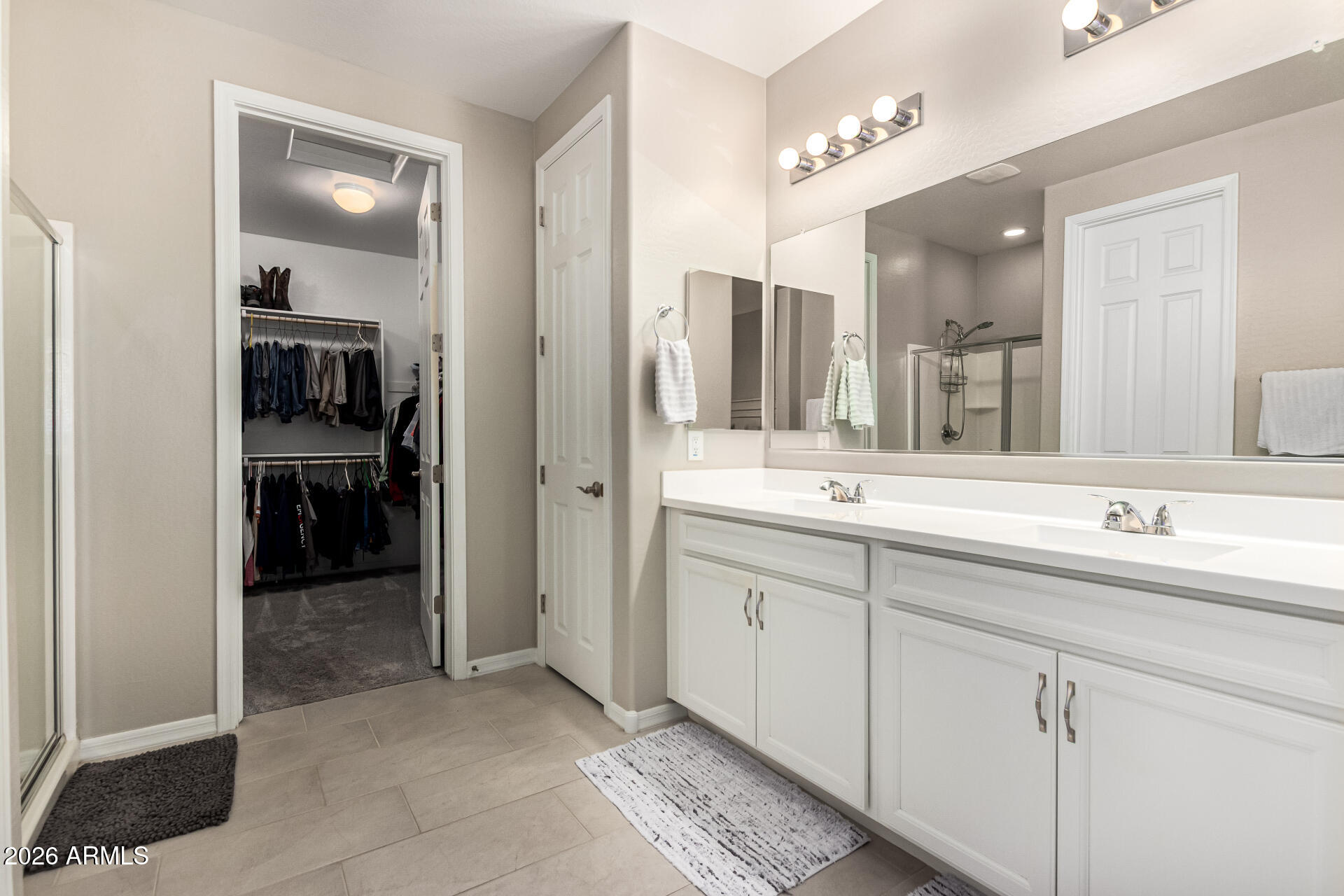 22494 East Russet Road Queen Creek, AZ 85142 - Photo 22 of 43 a bathroom with a double vanity sink and a mirror