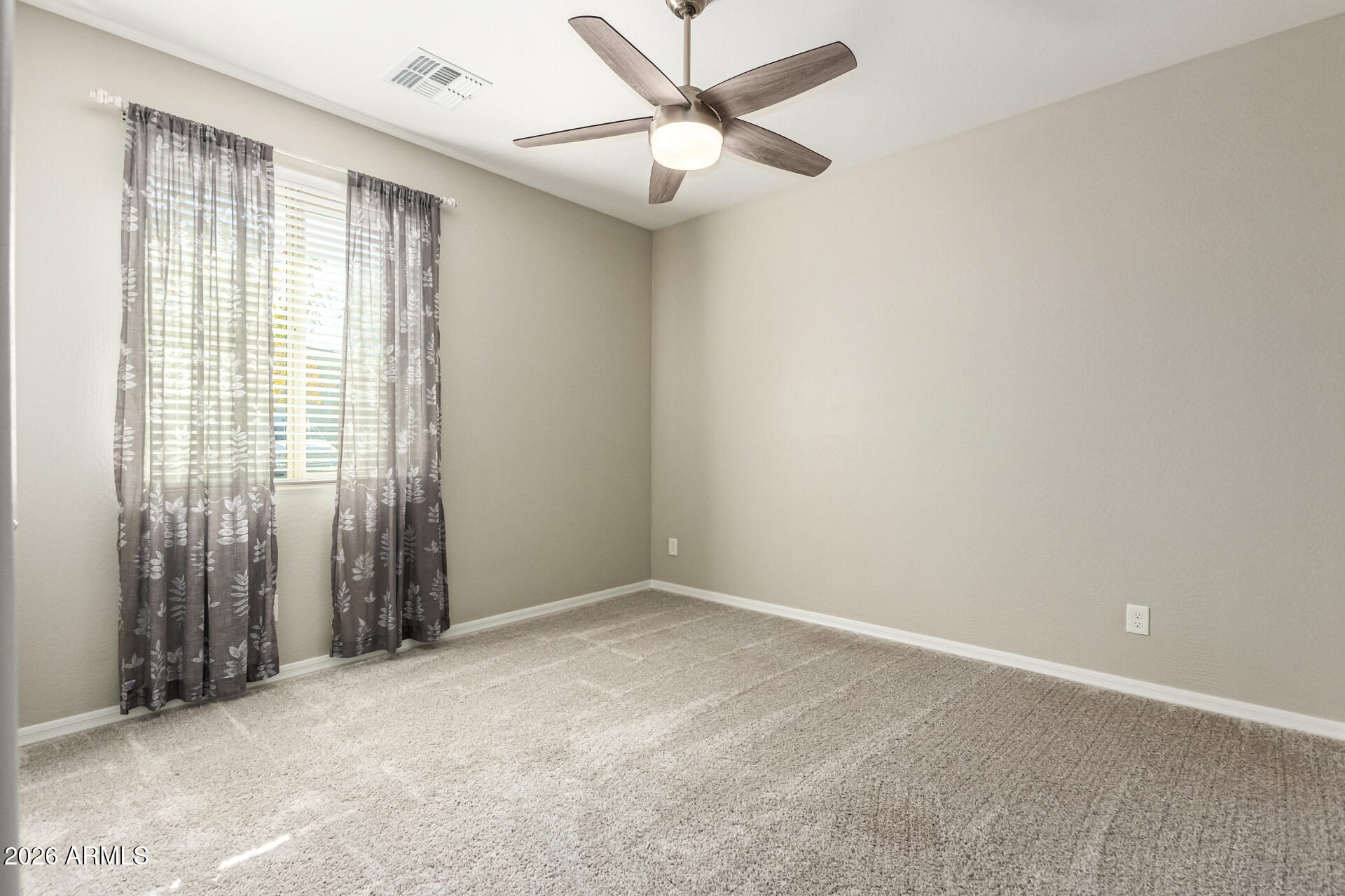 22494 East Russet Road Queen Creek, AZ 85142 - Photo 26 of 43 an empty room with fan and windows