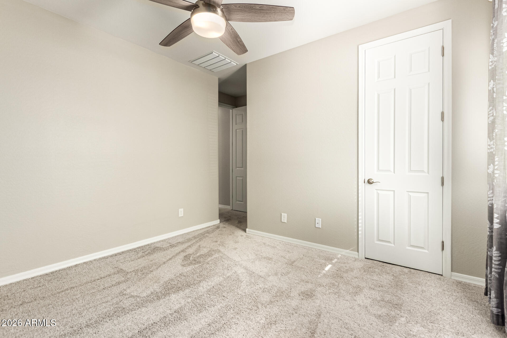 22494 East Russet Road Queen Creek, AZ 85142 - Photo 27 of 43 an empty room with a chandelier fan and windows